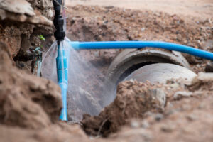 Home Water Line Emerging From Ground, Leaking and Spraying Water