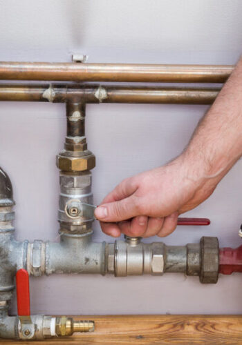 Boss Plumbing Plumber Performs a Commercial Plumbing Repair at a Commercial Property