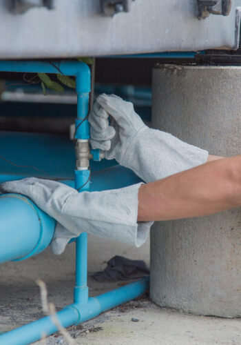 Trained and Licensed Boss Plumbing Plumber Performing a Repair on a Commercial Property's Sewer Line