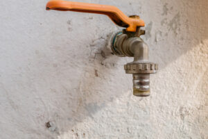 Home Gas Line Earthquake Shut Off Valve Protruding from Wall