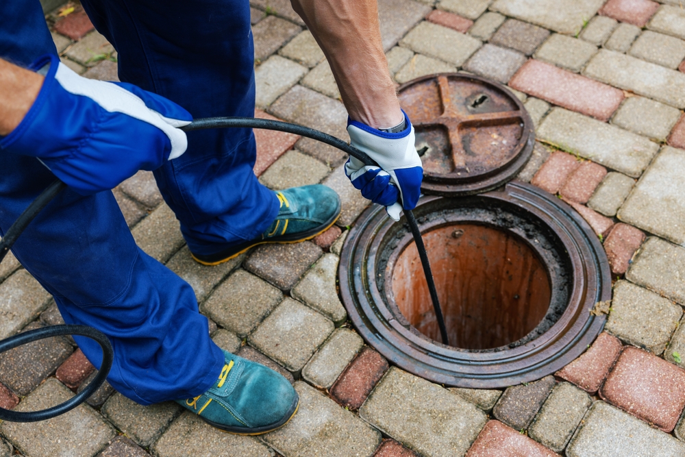 Plumber providing professional hydro jetting services